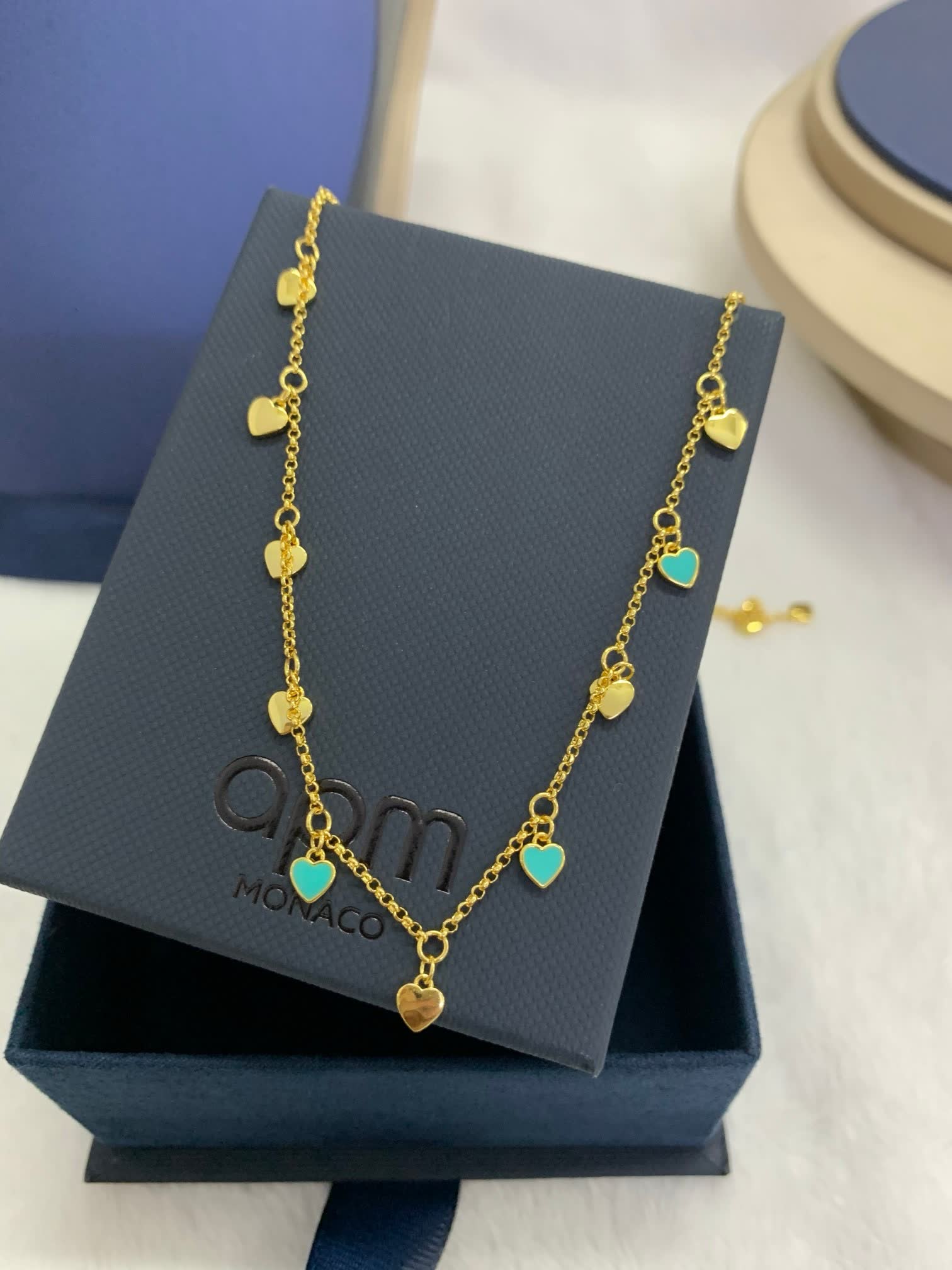 APM Monaco Gold Tone Blue Stone Heart Necklace